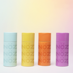 Load image into Gallery viewer, A front view of Nözscreen sunscreen that stick out in different colors 
